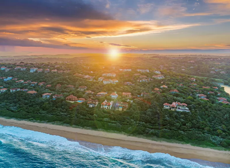 Aerial sunset view of Zimbali coastal estates and beach